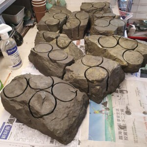 Sulphide cores in rough - raw rocks that will be transformed into polished spheres