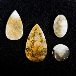 Gold in quartz cabochons in teardrop, oval and circular shape